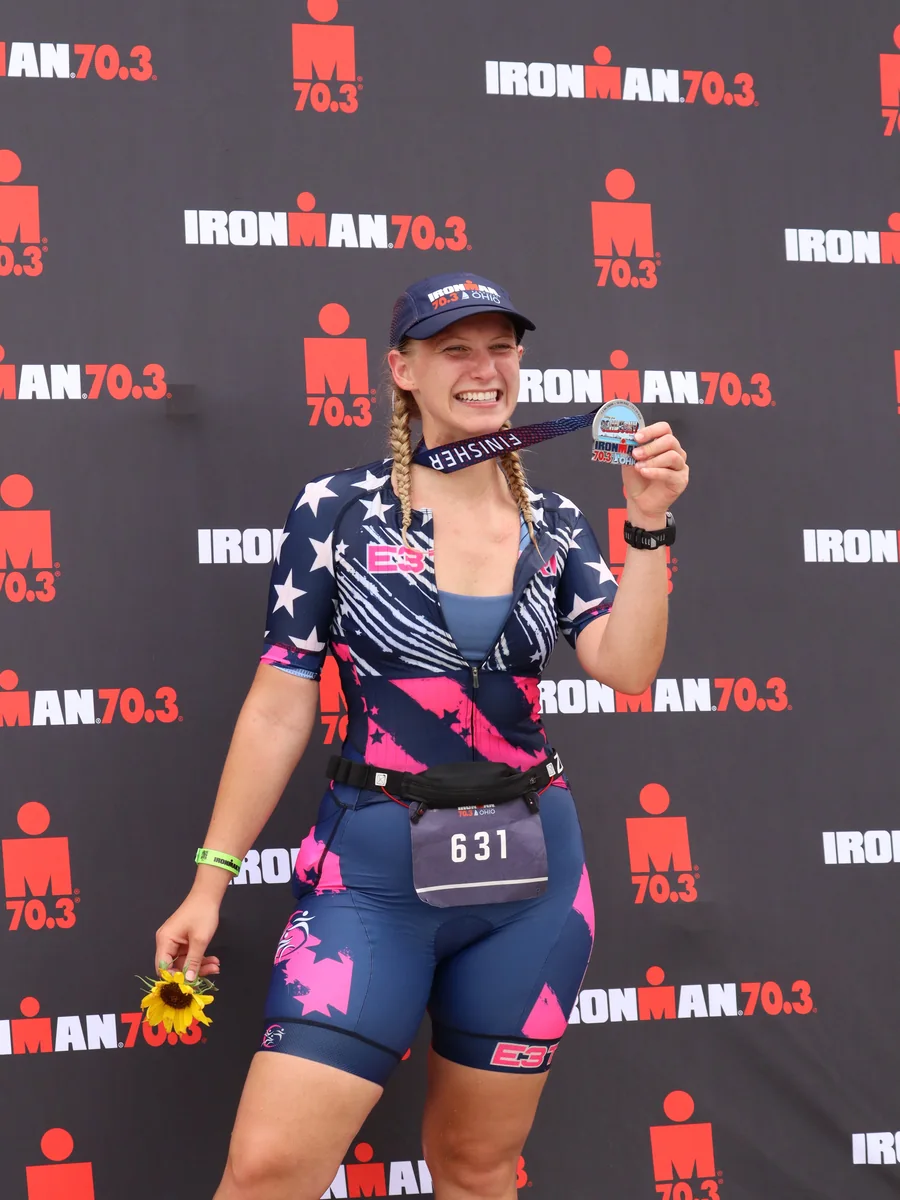 Triathlete celebrating at the finish line